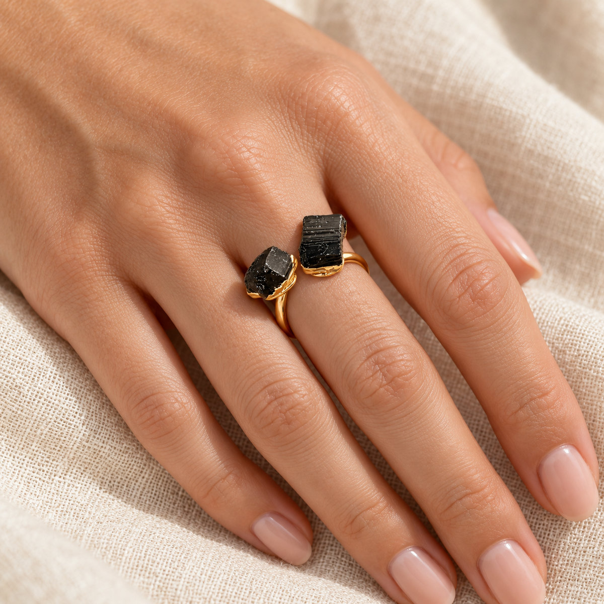 Steady Ground black tourmaline ring styled on a hand