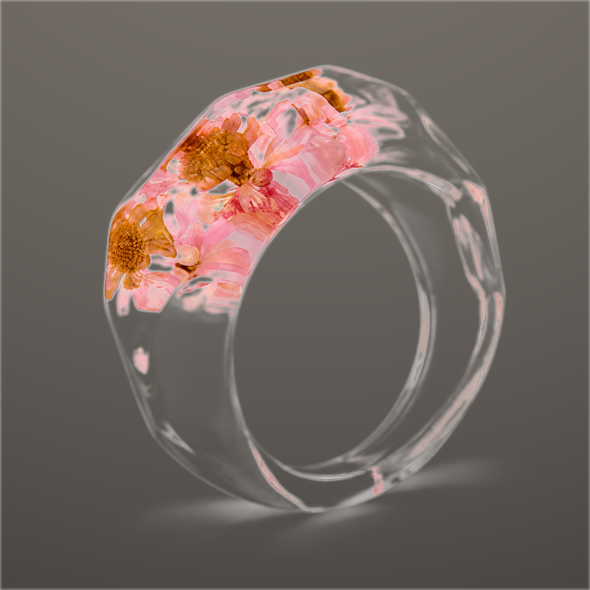 Blush Petal clear faceted resin ring with soft pink pressed flowers across the top