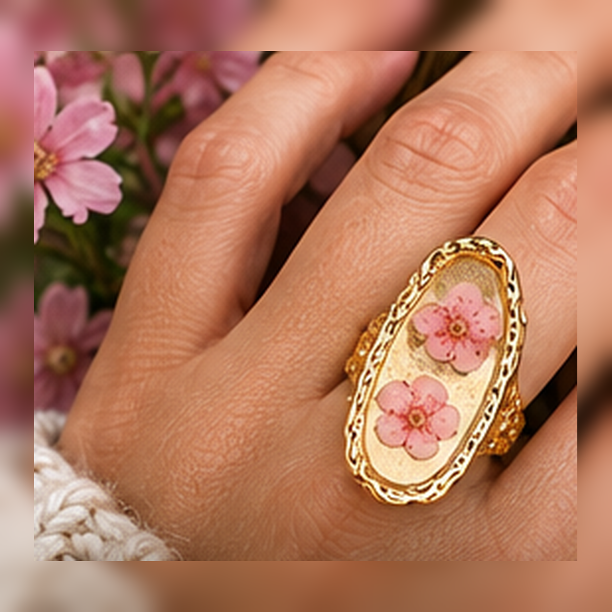 Model hand wearing the Blushing Blossom Renewal Ring