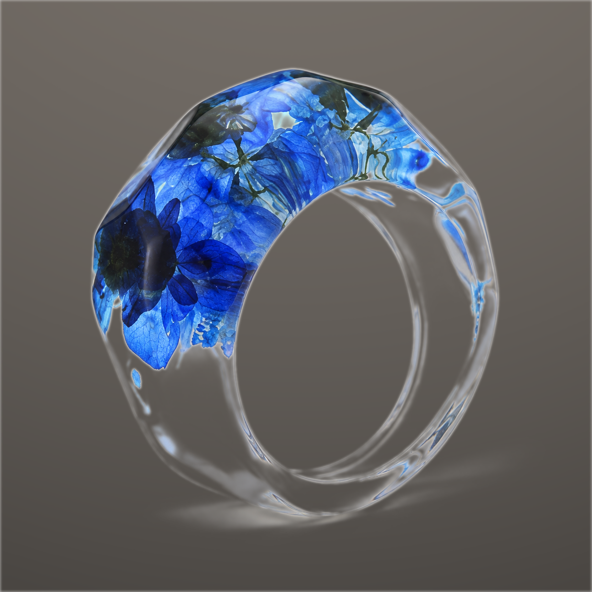 Cobalt Cluster clear faceted resin ring with rich cobalt blue pressed flowers across the top