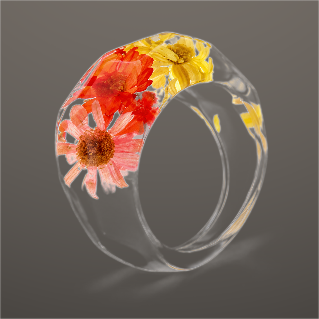 Coral Sunburst clear faceted resin ring with coral pink and golden pressed flowers across the top