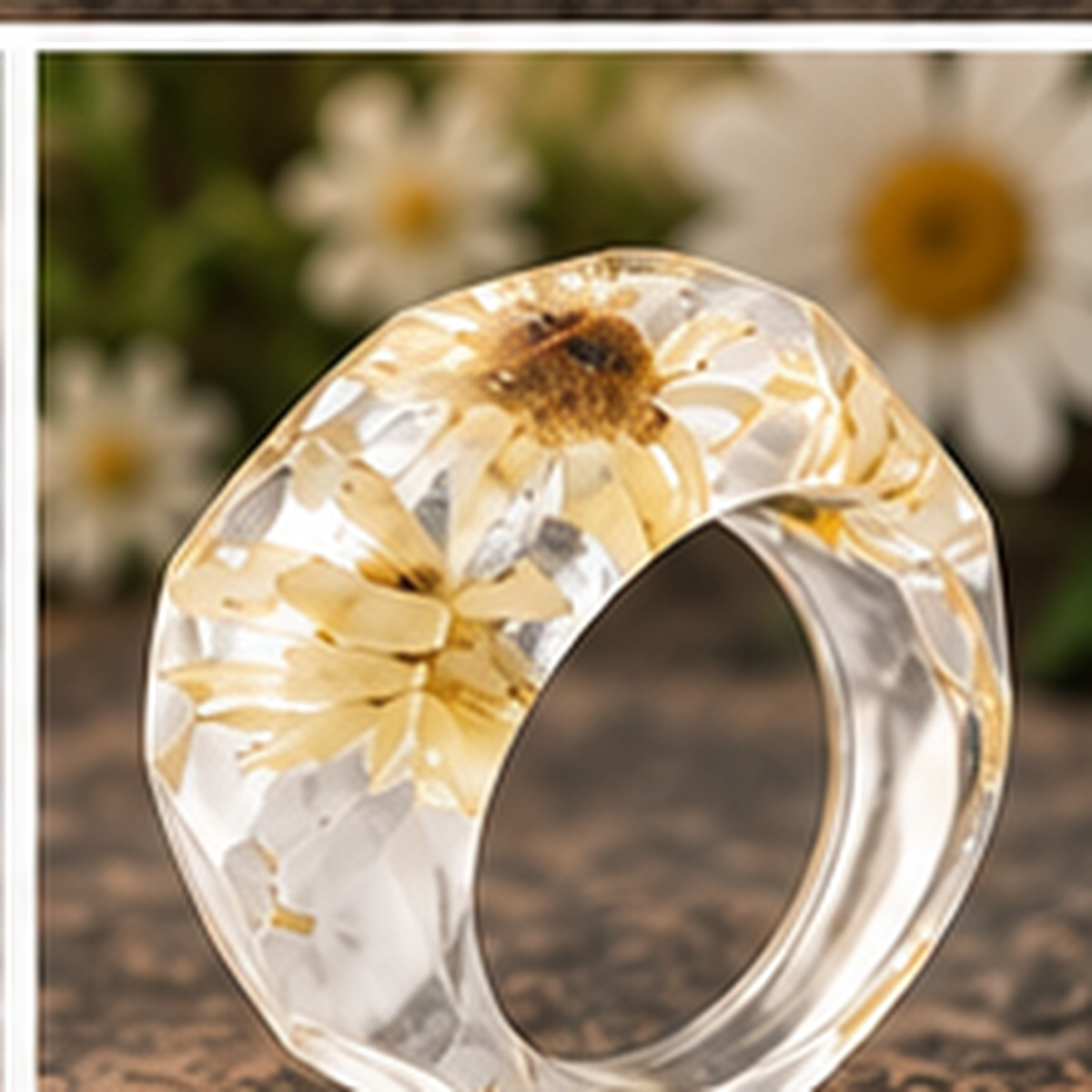 Golden Daisy Faceted Wildflower Resin Ring with natural floral background