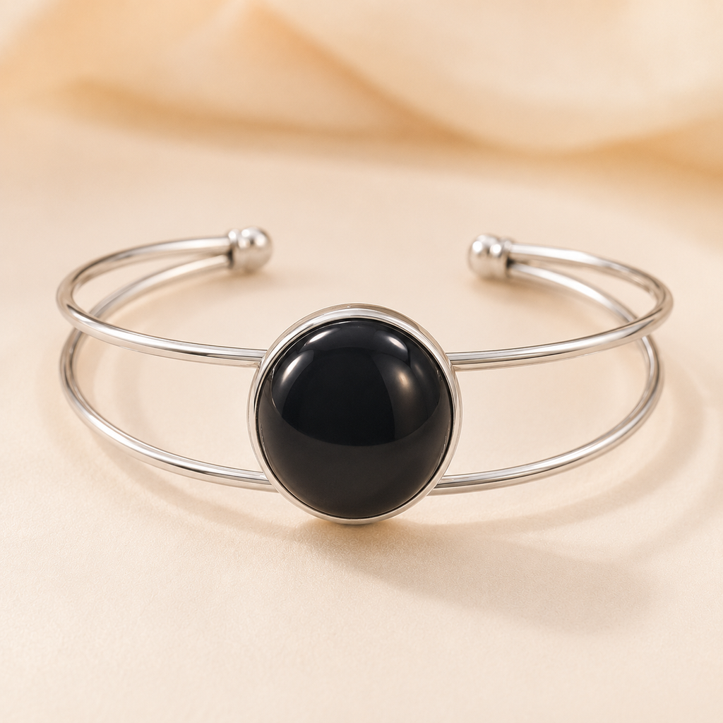 Moonlit Magic silver double-band bangle with a round black stone.