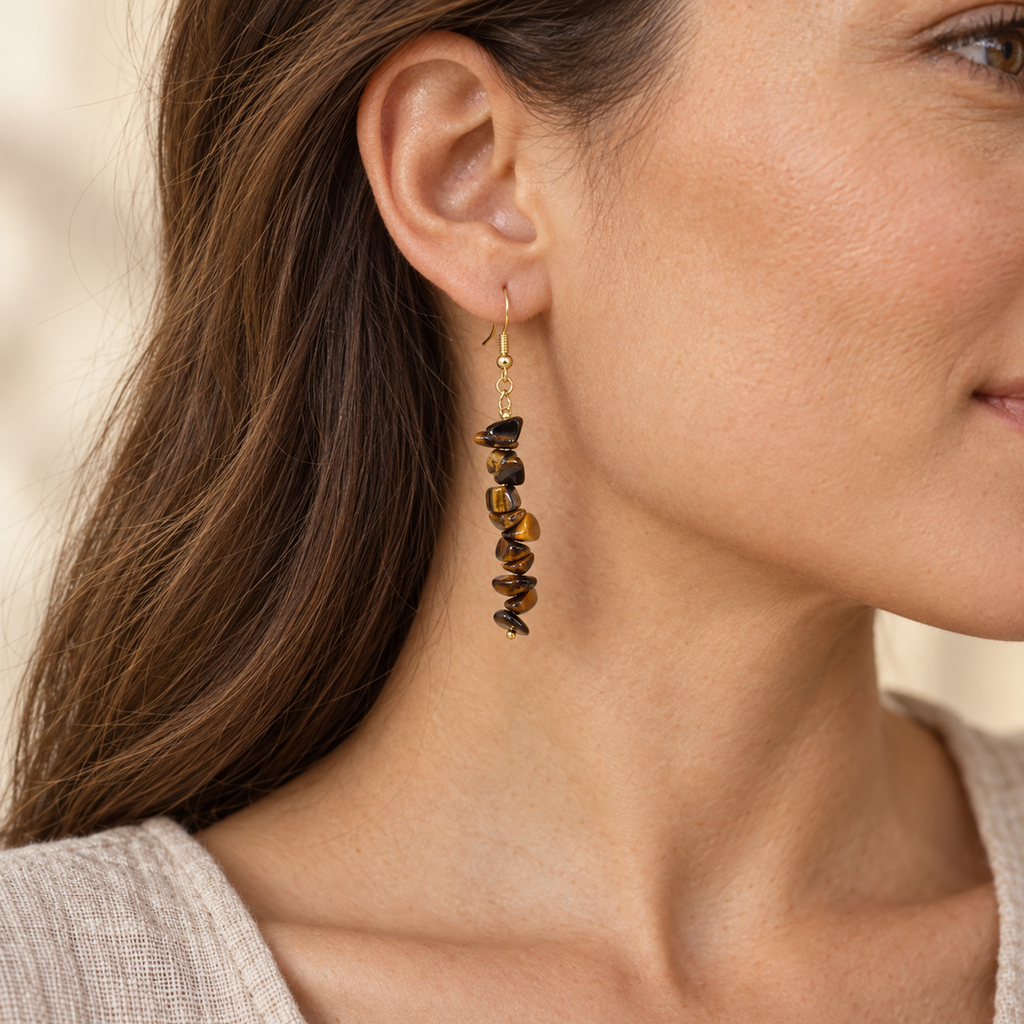 Model wearing Tiger's Eye stone chip drop earrings with gold-tone hooks.