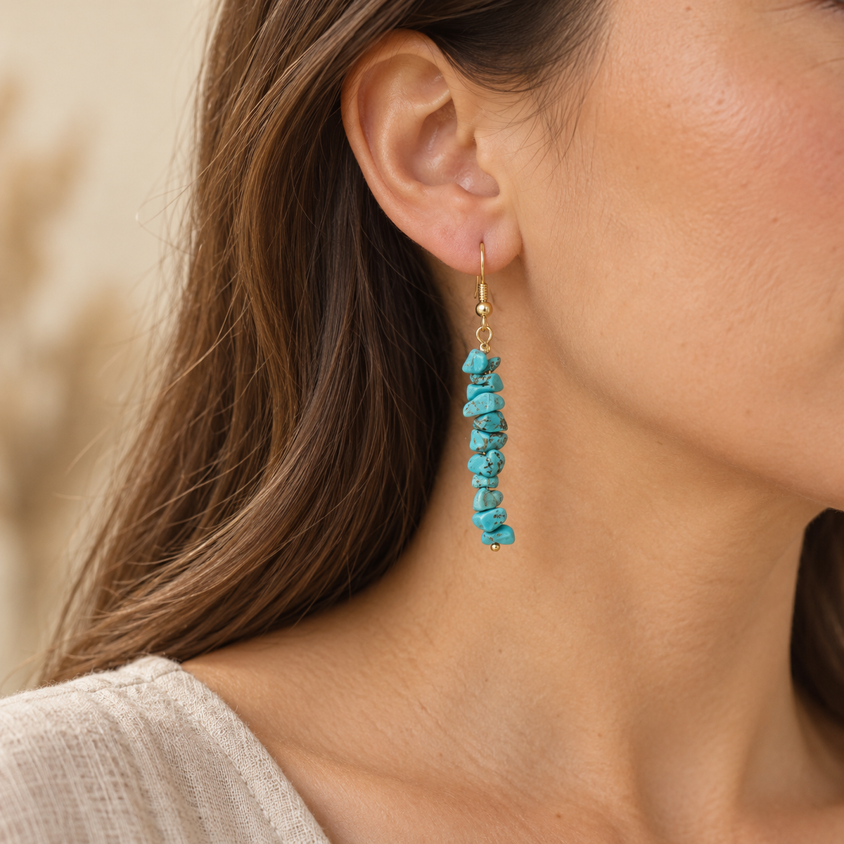 Model wearing Turquoise stone chip drop earrings with gold-tone hooks.