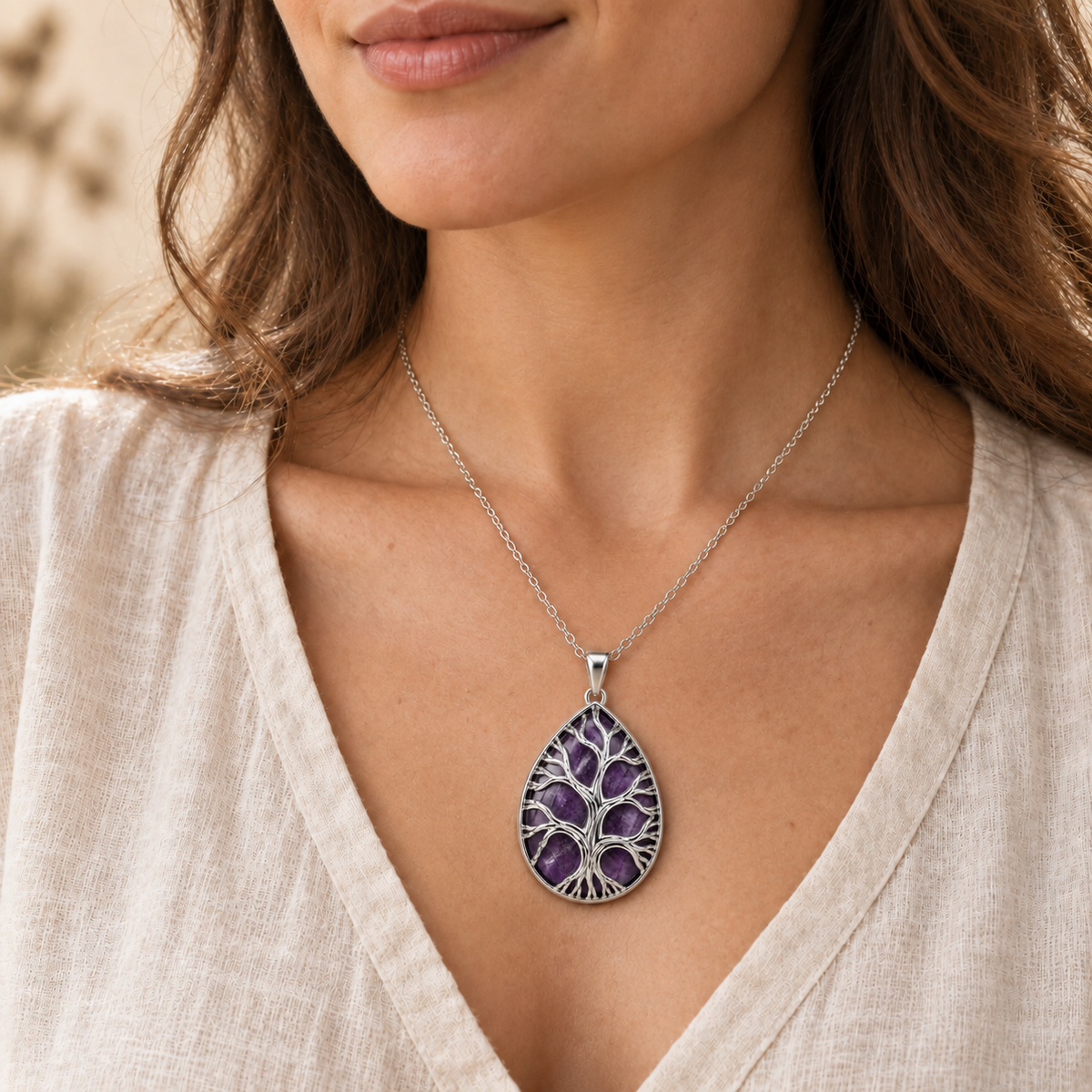 Model wearing the Dark Amethyst teardrop Tree of Life necklace.