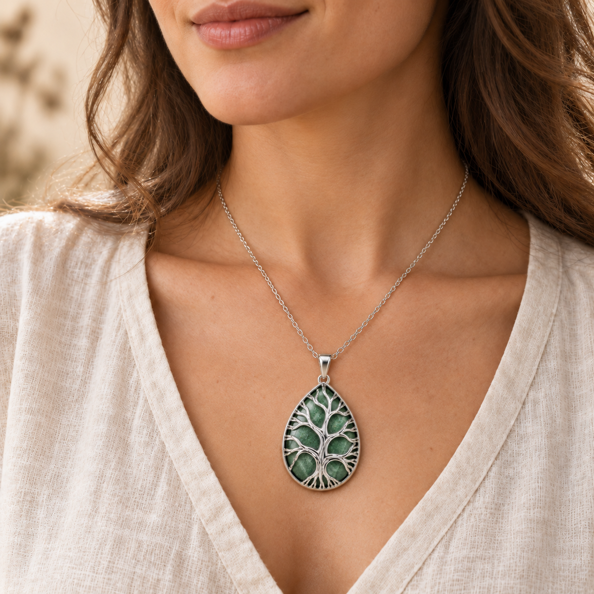 Model wearing the Green Aventurine teardrop Tree of Life necklace.