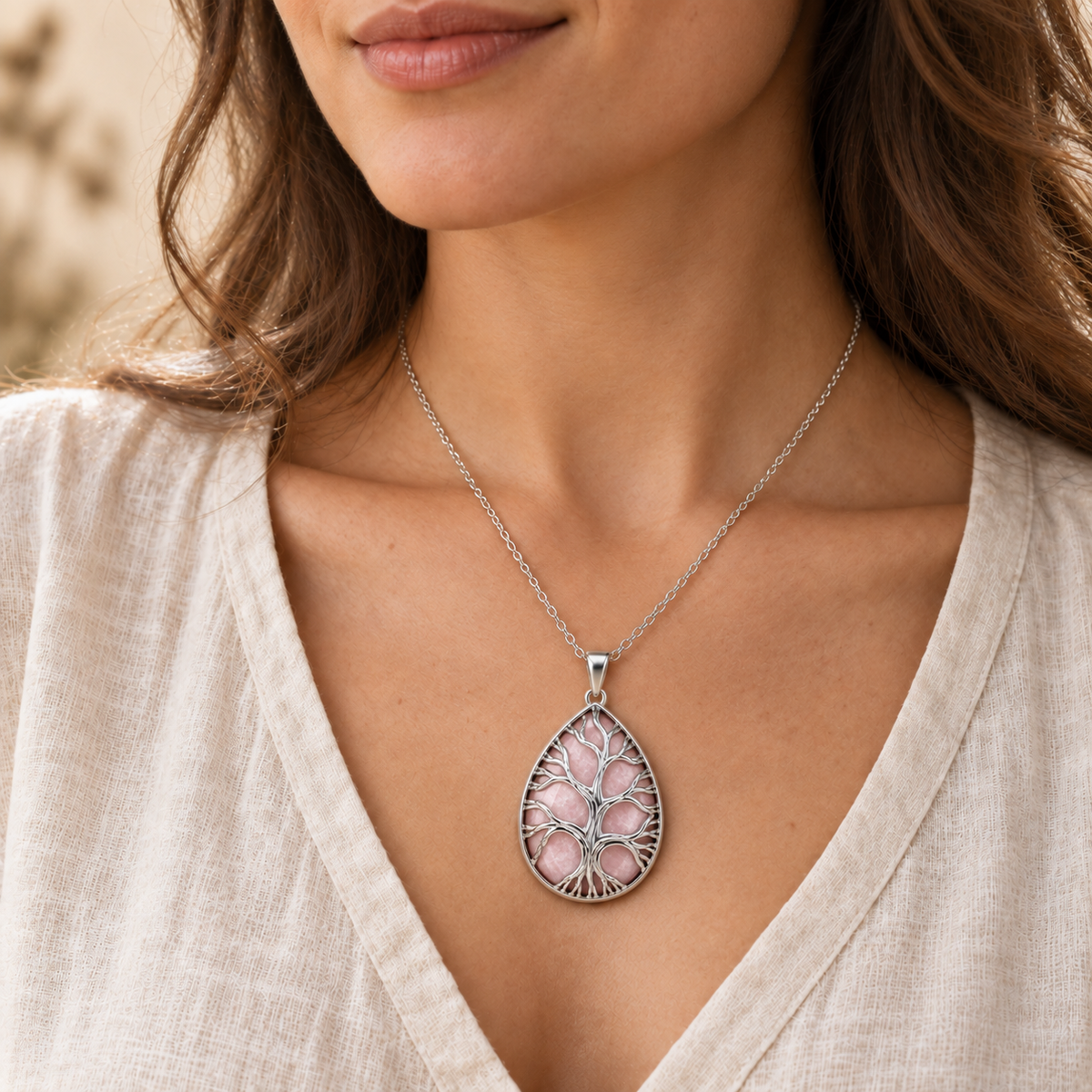 Model wearing the Rose Quartz teardrop Tree of Life necklace.