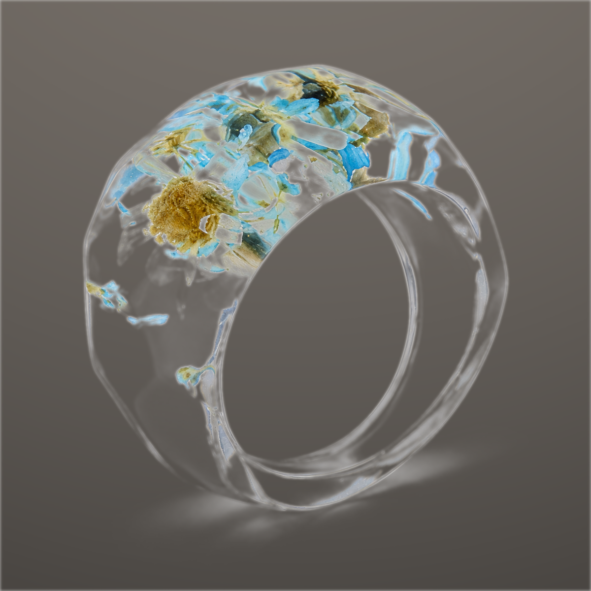 Skyglass Bloom clear faceted resin ring with pale blue and white pressed flowers across the top