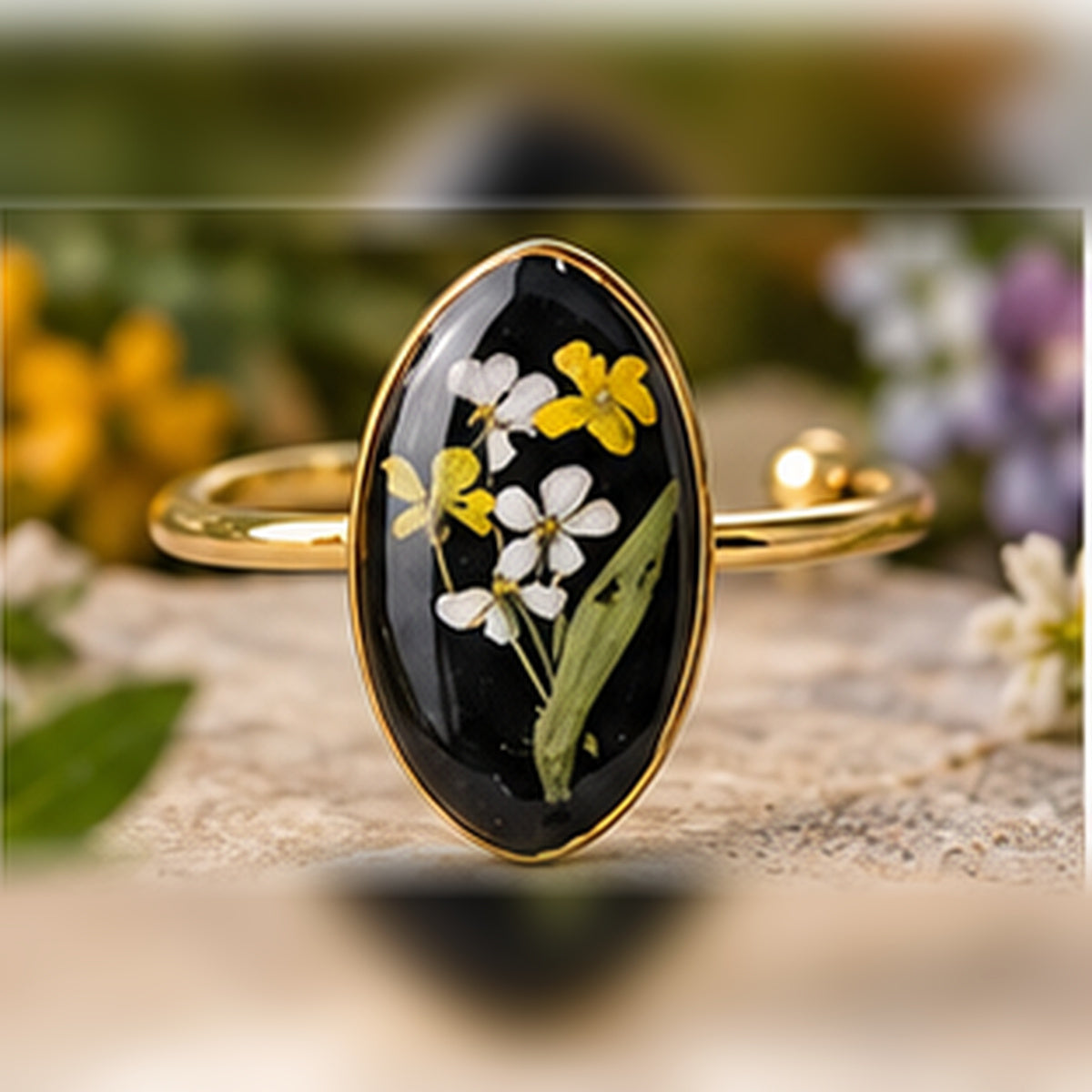 Sunshine Daisies adjustable stainless steel pressed-flower ring with white and yellow daisies on black.