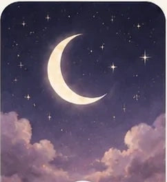 A crescent moon in a soft night sky